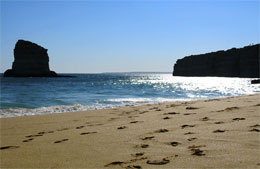 Beach scene with footprints in sand