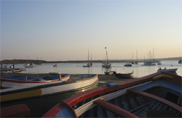 View of the sea with small boat in foregound